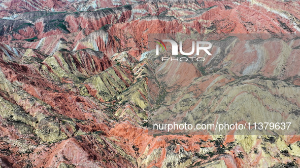 An aerial photo is showing the Danxia landform group in Xinghua village, Lanzhou city, northwest China's Gansu province, in Lanzhou, China,...