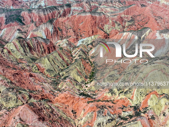 An aerial photo is showing the Danxia landform group in Xinghua village, Lanzhou city, northwest China's Gansu province, in Lanzhou, China,...