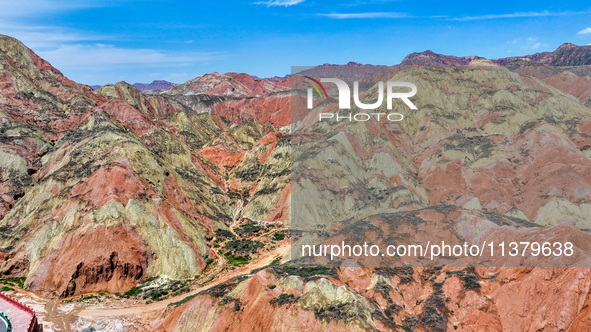 An aerial photo is showing the Danxia landform group in Xinghua village, Lanzhou city, northwest China's Gansu province, in Lanzhou, China,...