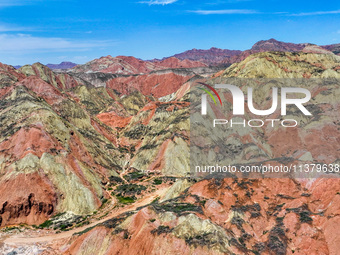 An aerial photo is showing the Danxia landform group in Xinghua village, Lanzhou city, northwest China's Gansu province, in Lanzhou, China,...