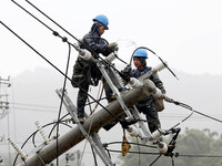 A line is being repaired in Si'an village, Rongan County, Liuzhou City, South China's Guangxi Zhuang Autonomous region, on July 2, 2024. (