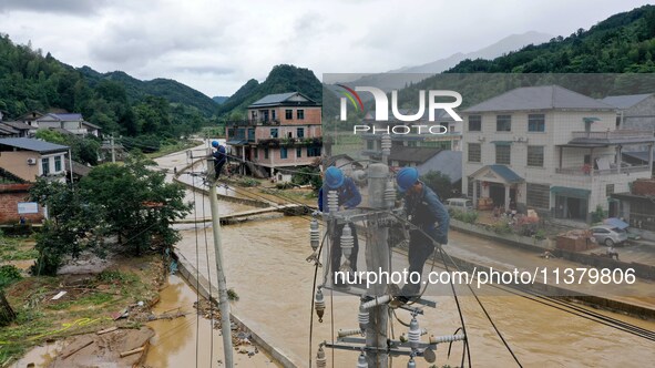 A line is being repaired in Si'an village, Rongan County, Liuzhou City, South China's Guangxi Zhuang Autonomous region, on July 2, 2024. 