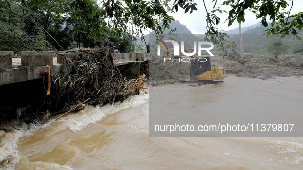 Workers are cleaning a river in Si 'an village, Rongan county, Liuzhou city, South China's Guangxi Zhuang Autonomous region, in Liuzhou, Chi...