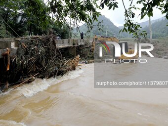 Workers are cleaning a river in Si 'an village, Rongan county, Liuzhou city, South China's Guangxi Zhuang Autonomous region, in Liuzhou, Chi...