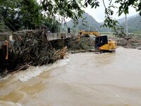 Workers are cleaning a river in Si 'an village, Rongan county, Liuzhou city, South China's Guangxi Zhuang Autonomous region, in Liuzhou, Chi...