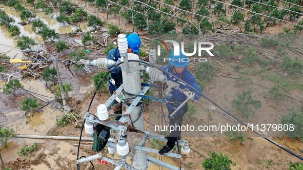 A line is being repaired in Si'an village, Rongan County, Liuzhou City, South China's Guangxi Zhuang Autonomous region, on July 2, 2024. 