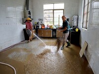 Villagers are cleaning houses soaked by floods in Si 'an village, Rongan county, Liuzhou city, South China's Guangxi Zhuang Autonomous regio...