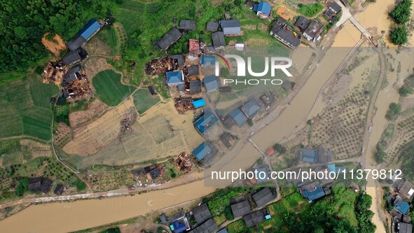 An aerial photo is showing Si 'an village after a flood in Rongan county, Liuzhou, China, on July 2, 2024, in South China's Guangxi Zhuang A...