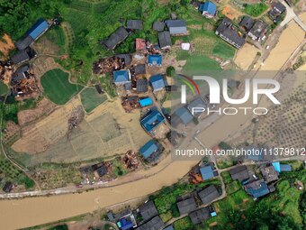 An aerial photo is showing Si 'an village after a flood in Rongan county, Liuzhou, China, on July 2, 2024, in South China's Guangxi Zhuang A...