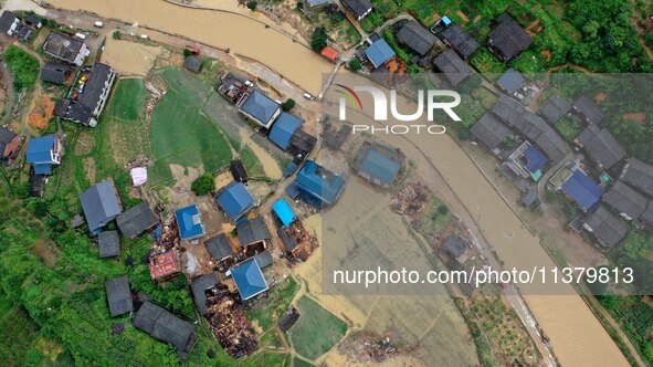 An aerial photo is showing Si 'an village after a flood in Rongan county, Liuzhou, China, on July 2, 2024, in South China's Guangxi Zhuang A...