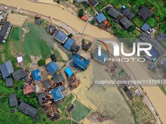 An aerial photo is showing Si 'an village after a flood in Rongan county, Liuzhou, China, on July 2, 2024, in South China's Guangxi Zhuang A...