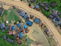 An aerial photo is showing Si 'an village after a flood in Rongan county, Liuzhou, China, on July 2, 2024, in South China's Guangxi Zhuang A...