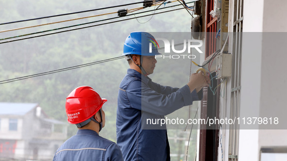 A line is being repaired in Si'an village, Rongan County, Liuzhou City, South China's Guangxi Zhuang Autonomous region, on July 2, 2024. 