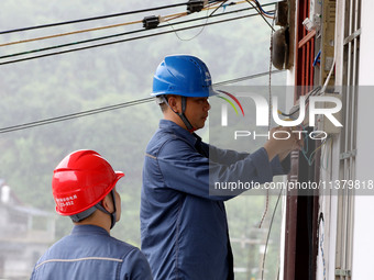 A line is being repaired in Si'an village, Rongan County, Liuzhou City, South China's Guangxi Zhuang Autonomous region, on July 2, 2024. (