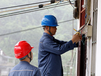 A line is being repaired in Si'an village, Rongan County, Liuzhou City, South China's Guangxi Zhuang Autonomous region, on July 2, 2024. (