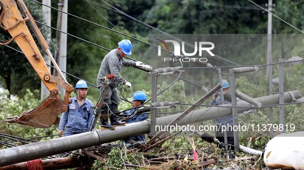 A line is being repaired in Si'an village, Rongan County, Liuzhou City, South China's Guangxi Zhuang Autonomous region, on July 2, 2024. 