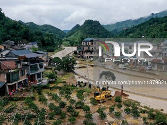 A line is being repaired in Si'an village, Rongan County, Liuzhou City, South China's Guangxi Zhuang Autonomous region, on July 2, 2024. (