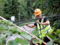 A line is being repaired in Si'an village, Rongan County, Liuzhou City, South China's Guangxi Zhuang Autonomous region, on July 2, 2024. (