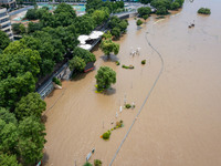 A pedestrian walkway and a platform are flooding in the Nanjing section of the Yangtze River in Nanjing, Jiangsu province, China, on July 3,...