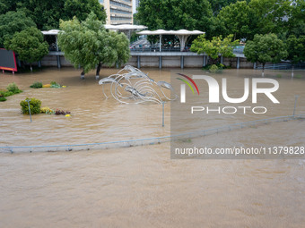 A pedestrian walkway and a platform are flooding in the Nanjing section of the Yangtze River in Nanjing, Jiangsu province, China, on July 3,...