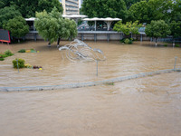 A pedestrian walkway and a platform are flooding in the Nanjing section of the Yangtze River in Nanjing, Jiangsu province, China, on July 3,...