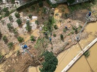 Electric power workers are repairing a power supply line at a pole in Si'an village, Rongan county, Liuzhou city, South China's Guangxi Zhua...