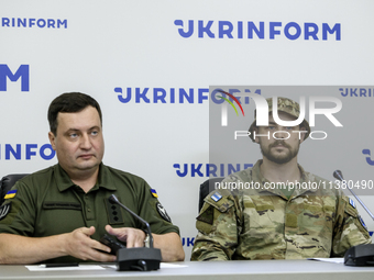 Andriy Yusov (L), a representative of the Defence Intelligence of Ukraine, and a Russian citizen, a direct perpetrator of the action, who is...