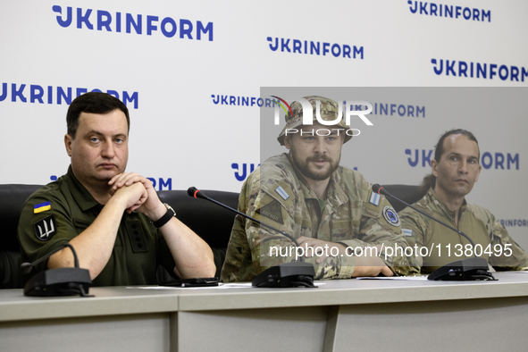 Andriy Yusov, a representative of the Defence Intelligence of Ukraine (L), a Russian citizen and direct perpetrator of the action, who is no...