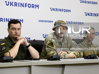 Andriy Yusov, a representative of the Defence Intelligence of Ukraine (L), a Russian citizen and direct perpetrator of the action, who is no...