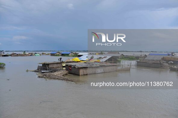 A hut is partially submerged in a flood-affected area in Morigaon District of Assam, India, on July 3, 2024. 