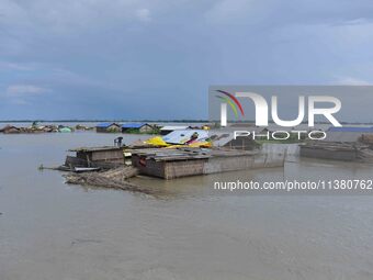 A hut is partially submerged in a flood-affected area in Morigaon District of Assam, India, on July 3, 2024. (