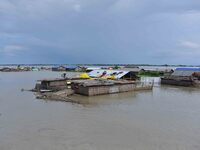 A hut is partially submerged in a flood-affected area in Morigaon District of Assam, India, on July 3, 2024. (