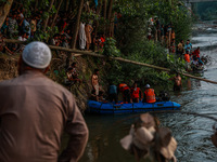 Villagers are watching as SDRF is launching an operation to trace the body of a young man who drowned in Nalla Puhroo while taking a bath on...