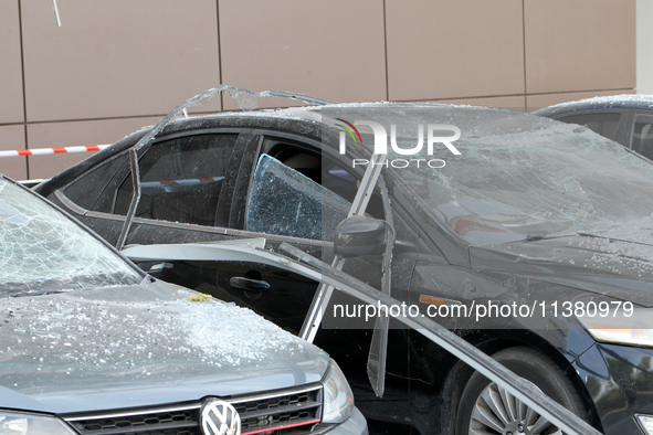 Damaged cars are being pictured outside a shopping mall affected by the Russian missile strike in Dnipro, Ukraine, on July 3, 2024. At least...