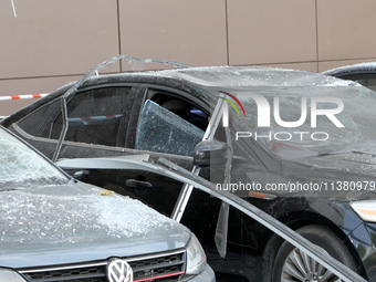 Damaged cars are being pictured outside a shopping mall affected by the Russian missile strike in Dnipro, Ukraine, on July 3, 2024. At least...