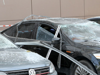 Damaged cars are being pictured outside a shopping mall affected by the Russian missile strike in Dnipro, Ukraine, on July 3, 2024. At least...