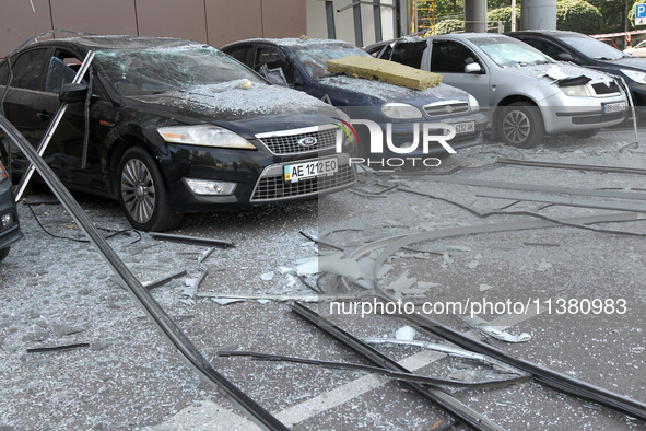 Damaged cars are being pictured outside a shopping mall affected by the Russian missile strike in Dnipro, Ukraine, on July 3, 2024. At least...