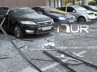 Damaged cars are being pictured outside a shopping mall affected by the Russian missile strike in Dnipro, Ukraine, on July 3, 2024. At least...