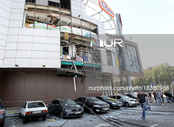 Damaged cars are being pictured outside a shopping mall affected by the Russian missile strike in Dnipro, Ukraine, on July 3, 2024. At least...