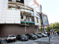 Damaged cars are being pictured outside a shopping mall affected by the Russian missile strike in Dnipro, Ukraine, on July 3, 2024. At least...