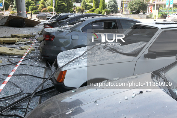 Damaged cars are being pictured outside a shopping mall affected by the Russian missile strike in Dnipro, Ukraine, on July 3, 2024. At least...