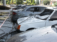 Damaged cars are being pictured outside a shopping mall affected by the Russian missile strike in Dnipro, Ukraine, on July 3, 2024. At least...