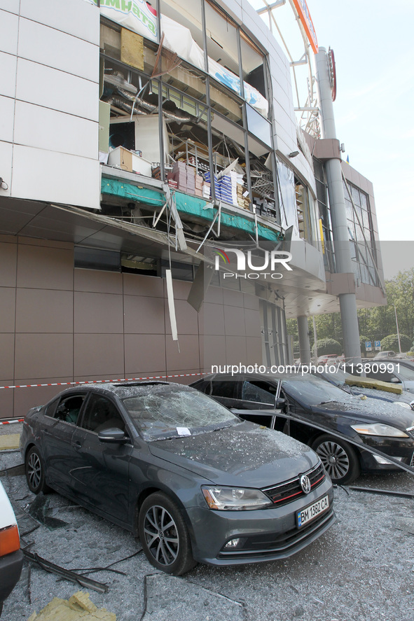 Damaged cars are being pictured outside a shopping mall affected by the Russian missile strike in Dnipro, Ukraine, on July 3, 2024. At least...