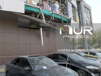 Damaged cars are being pictured outside a shopping mall affected by the Russian missile strike in Dnipro, Ukraine, on July 3, 2024. At least...