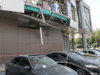 Damaged cars are being pictured outside a shopping mall affected by the Russian missile strike in Dnipro, Ukraine, on July 3, 2024. At least...