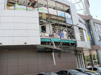 Damaged cars are being pictured outside a shopping mall affected by the Russian missile strike in Dnipro, Ukraine, on July 3, 2024. At least...