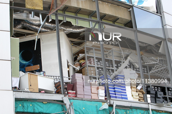 Shoe boxes are being stacked at a smashed window in a shopping mall damaged by the Russian missile strike in Dnipro, Ukraine, on July 3, 202...