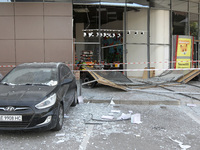 A damaged car is being pictured outside a shopping mall affected by the Russian missile strike in Dnipro, Ukraine, on July 3, 2024. At least...