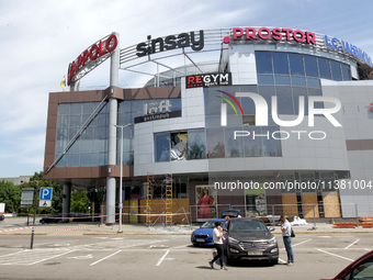 A shopping mall is being damaged by a Russian missile strike in Dnipro, Ukraine, on July 3, 2024. At least five people are being killed and...