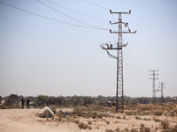 Palestinians are walking on Salah El Din Street in Deir al-Balah in the central Gaza Strip on July 3, 2024, amid the ongoing conflict betwee...